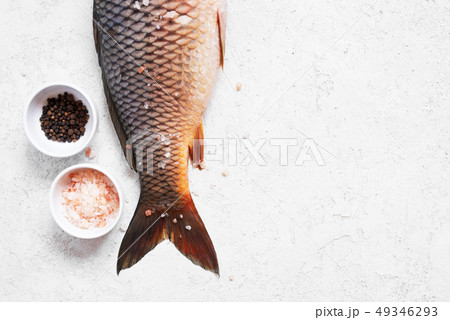 Raw freshwater carp with salt and pepper Raw freshwater carp with salt and pepper 49346293