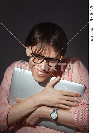 IT computer nerd. Creative teen millenial portrait indoors. Funny young man with happy face 49346426