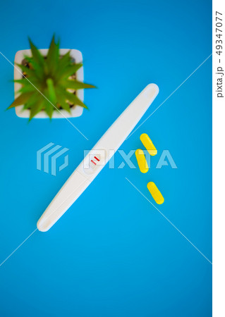 Pregnancy test. The result is positive with two strips. Treatment of infertility with pills, help in 49347077