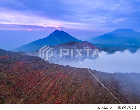 Dawn on the Slopes of the Volcano Ijen. Aerial Dawn on the Slopes of the Volcano Ijen. Aerial 49347651