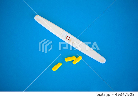The result is positive. Close up of pregnancy test and contraceptive pills birth control concept on The result is positive. Close up of pregnancy test and contraceptive pills birth control concept on 49347908