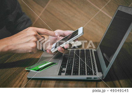 Businessman holding credit card and using 49349145