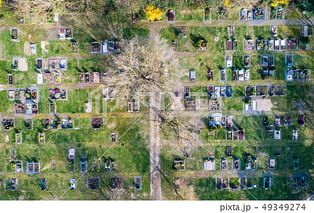 Aerial drone view of a church graveyard cemetary Germany 49349274