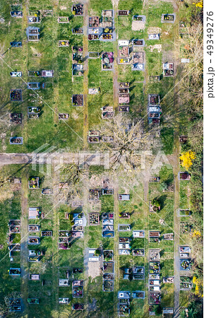 Aerial drone view of a church graveyard cemetary Germany 49349276