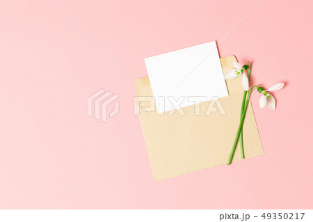 Pink envelope with a spring flower arrangement. Pink envelope with a spring flower arrangement. 49350217