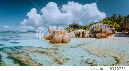 Impressive cloudscape at beautiful Anse Source d'Argent beach, La Digue Island, Seychelles Impressive cloudscape at beautiful Anse Source d'Argent beach, La Digue Island, Seychelles 49350772