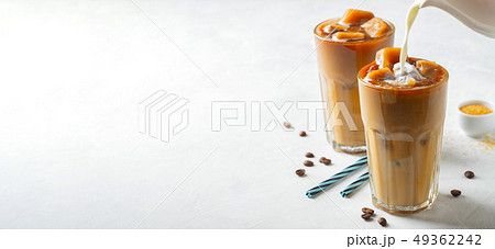 Two glasses of cold coffee on white background. Two glasses of cold coffee on white background. 49362242