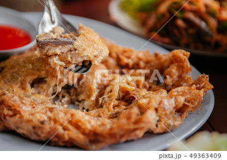 Thai crispy fried egg omelet with meckerel Thai crispy fried egg omelet with meckerel 49363409