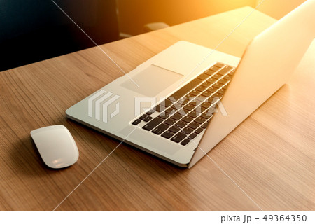 Laptop on table in empty corporate conference room 49364350