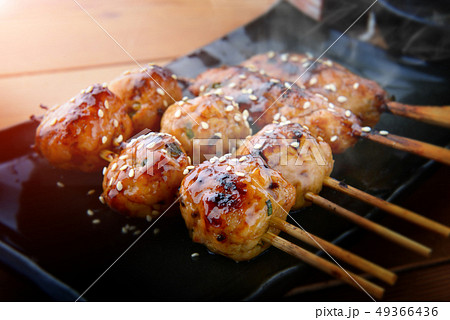 japanese meatball grill  or tsukune. 49366436