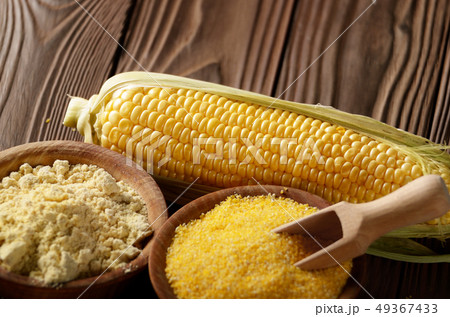 Bowl of corn grits corncob and corn flour on 49367433