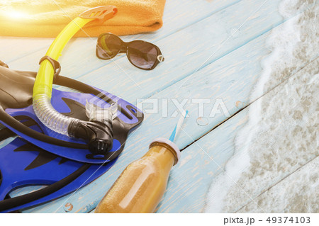 blue fins and snorkel for swimming on light blue blue fins and snorkel for swimming on light blue 49374103