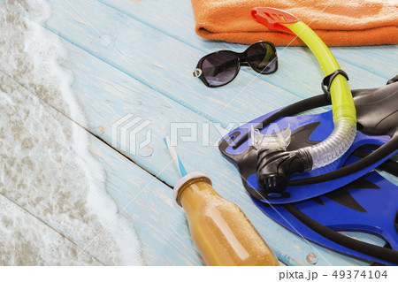 blue fins and snorkel for swimming on light blue blue fins and snorkel for swimming on light blue 49374104