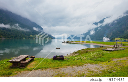 Summer cloudy Lustrafjorden fjord 49374485