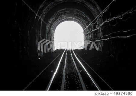Train tunnel. Old railway in cave. Hope of life Train tunnel. Old railway in cave. Hope of life 49374580