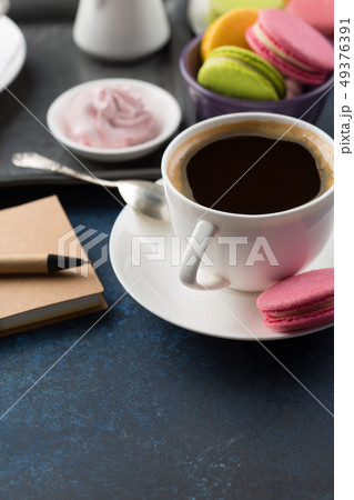 Cup of coffee and sweets on table Cup of coffee and sweets on table 49376391