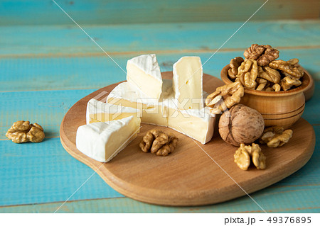 Cheese camembert or brie with walnut kernels Cheese camembert or brie with walnut kernels 49376895