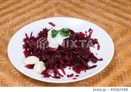Grated beets with garlic in a plate Grated beets with garlic in a plate 49382488