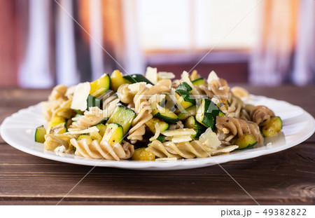 Fusilli pasta with zucchini with curtains Fusilli pasta with zucchini with curtains 49382822