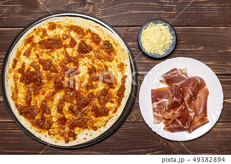 Recipe of pizza capriciosa on brown wood 49382894