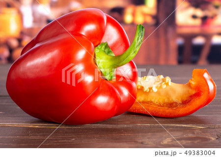 Fresh red paprika with rustic kitchen Fresh red paprika with rustic kitchen 49383004
