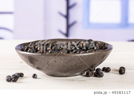 Dry juniper berries with blue window 49383117