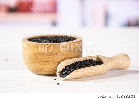 Black cumin seeds with kitchen behind Black cumin seeds with kitchen behind 49383201