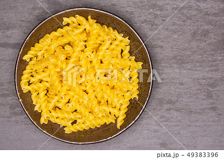 Raw italian torti pasta on grey stone 49383396