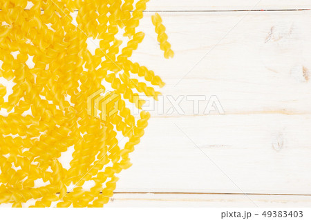 Raw italian torti pasta on grey wood Raw italian torti pasta on grey wood 49383403
