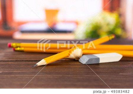 Yellow simple pencil with books on window 49383482