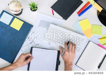 Businessman working writing business plan document 49384809