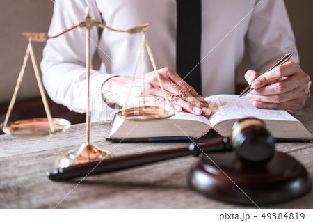 Male lawyer or judge working with Law books, gavel 49384819