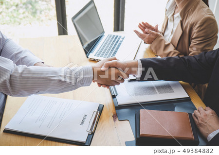 Greeting new colleagues, Handshake while job 49384882