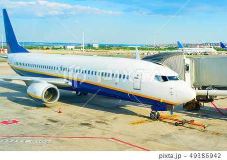 Airplane gangway airport runway 49386942