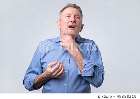 Sick mature man with pain in throat 49388219