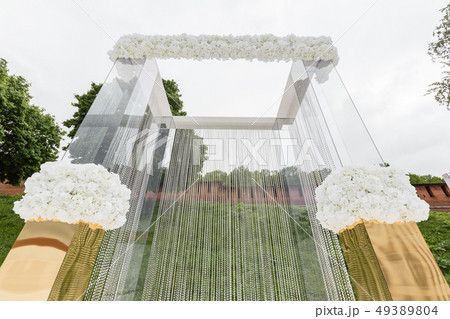 Crystal decorations for the wedding ceremony, luxurious decor. Beautiful arch decorated with chains 49389804