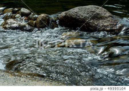 running of water stream from waterfall in tropical 49393104