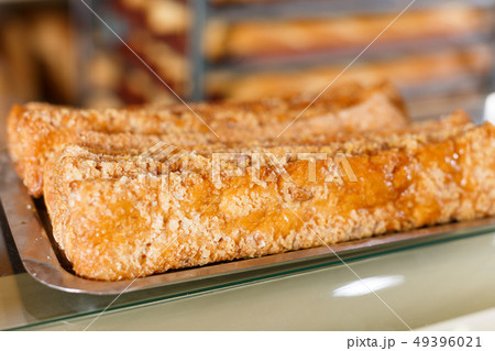 Tray with sweet pastry on bakery showcase 49396021