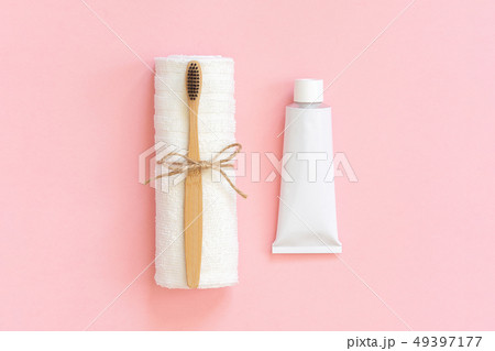 Natural eco-friendly bamboo brush on white towel Natural eco-friendly bamboo brush on white towel 49397177
