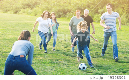 males and females kicking the ball 49398301