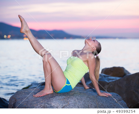 Beautiful sporty female doing aerobics Beautiful sporty female doing aerobics 49399254