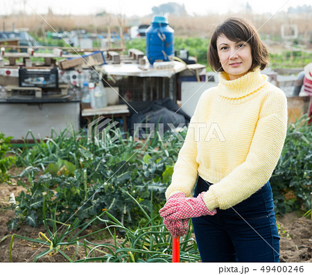 Portrait of woman in garden 49400246