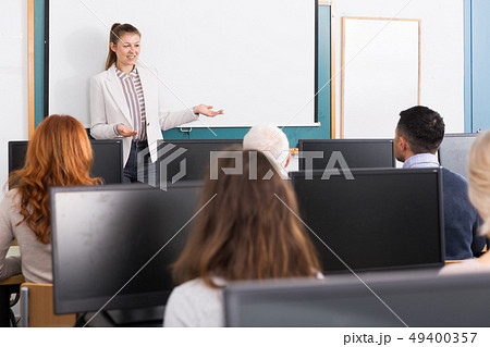 Young female trainer giving presentation 49400357