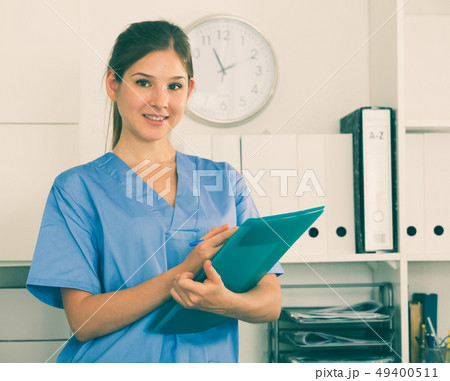 Female doctor writing notes in clinic 49400511