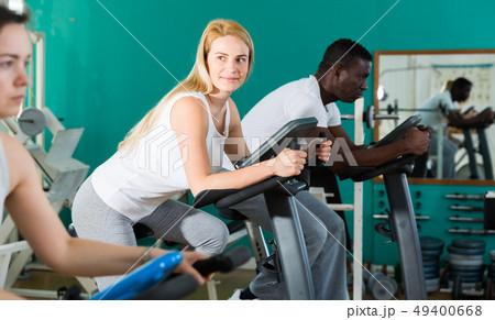 Man and two women at sport club Man and two women at sport club 49400668