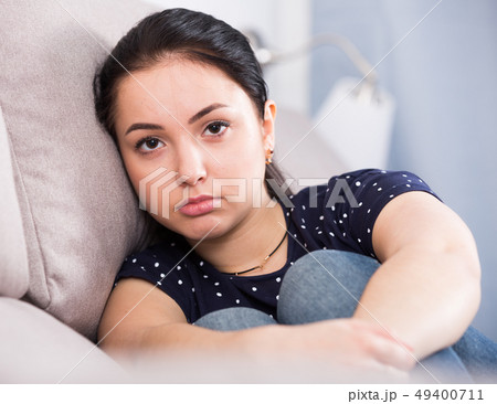 Portrait of sad brunette Portrait of sad brunette 49400711