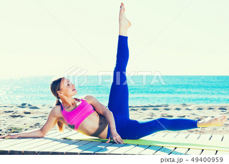 Female 30-40 years old is practicing yoga Female 30-40 years old is practicing yoga 49400959