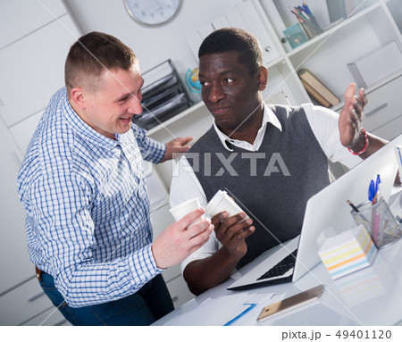 Positive business colleagues working in office Positive business colleagues working in office 49401120