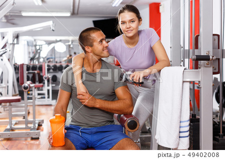 Man and woman posing at gym Man and woman posing at gym 49402008