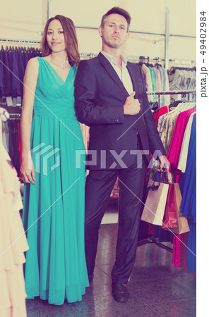 Family couple posing together in clothes shop 49402984